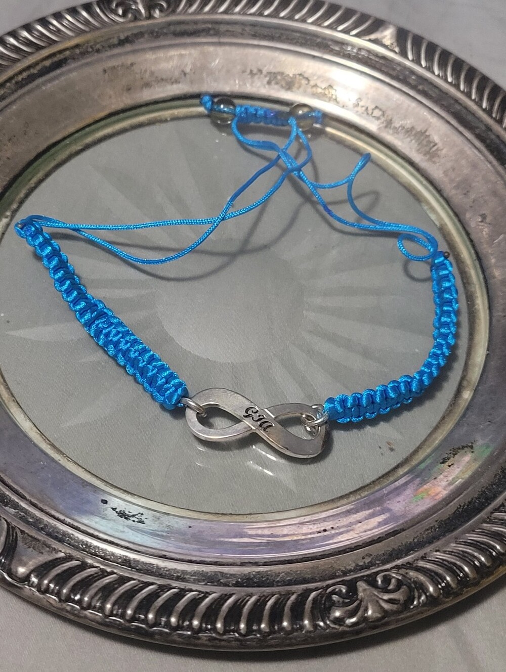 Adjustable Blue Infinity Cord Bracelet with Sterling Silver Accent